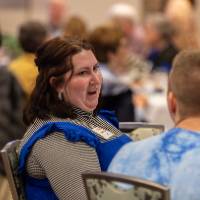 committee members talking at luncheon table